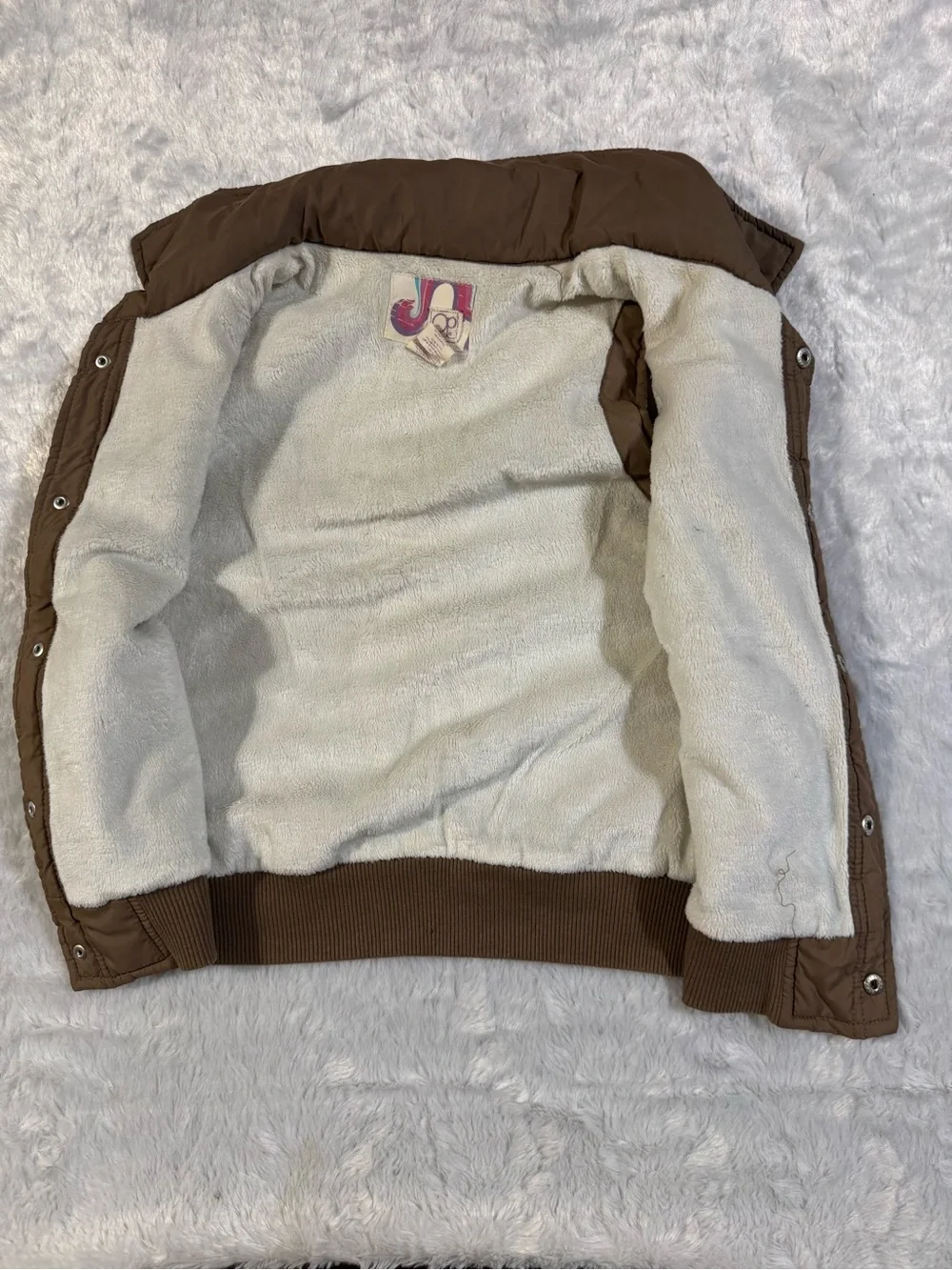 OP sleeveless puffer